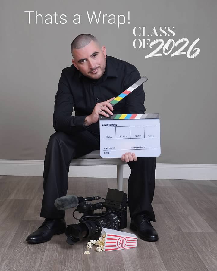 Wilmer Rodriguez with a film slate and camera